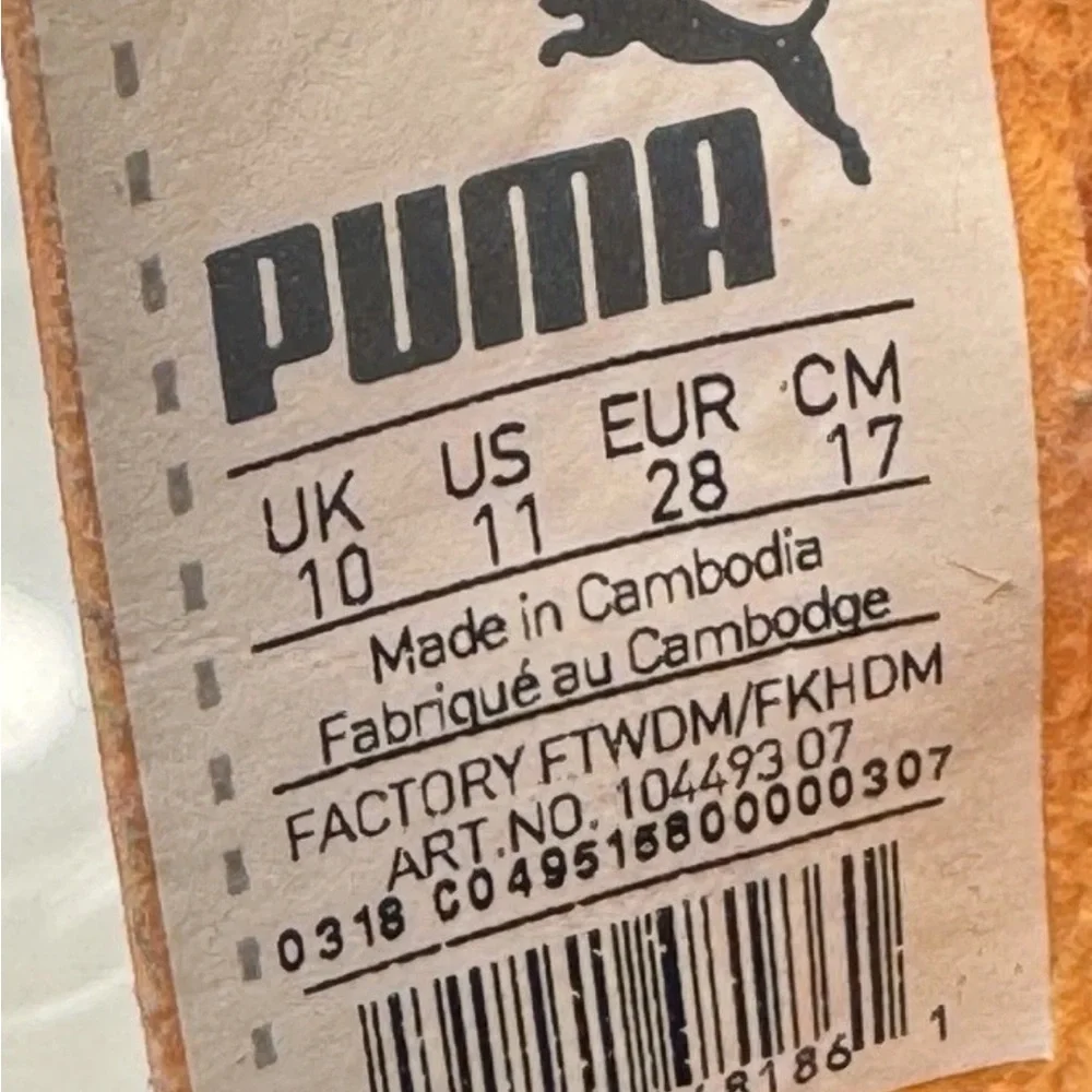 PUMA Kid’s Cleats in orange‎ and black